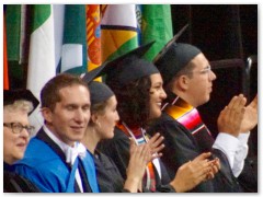 Halfway through the awarding of diplomas, they swap what direction people cross the stage, so I scrambled to get to the other side of the auditorium so I could get a picture of Hannah's face when she got her diploma, rather than her back. 
